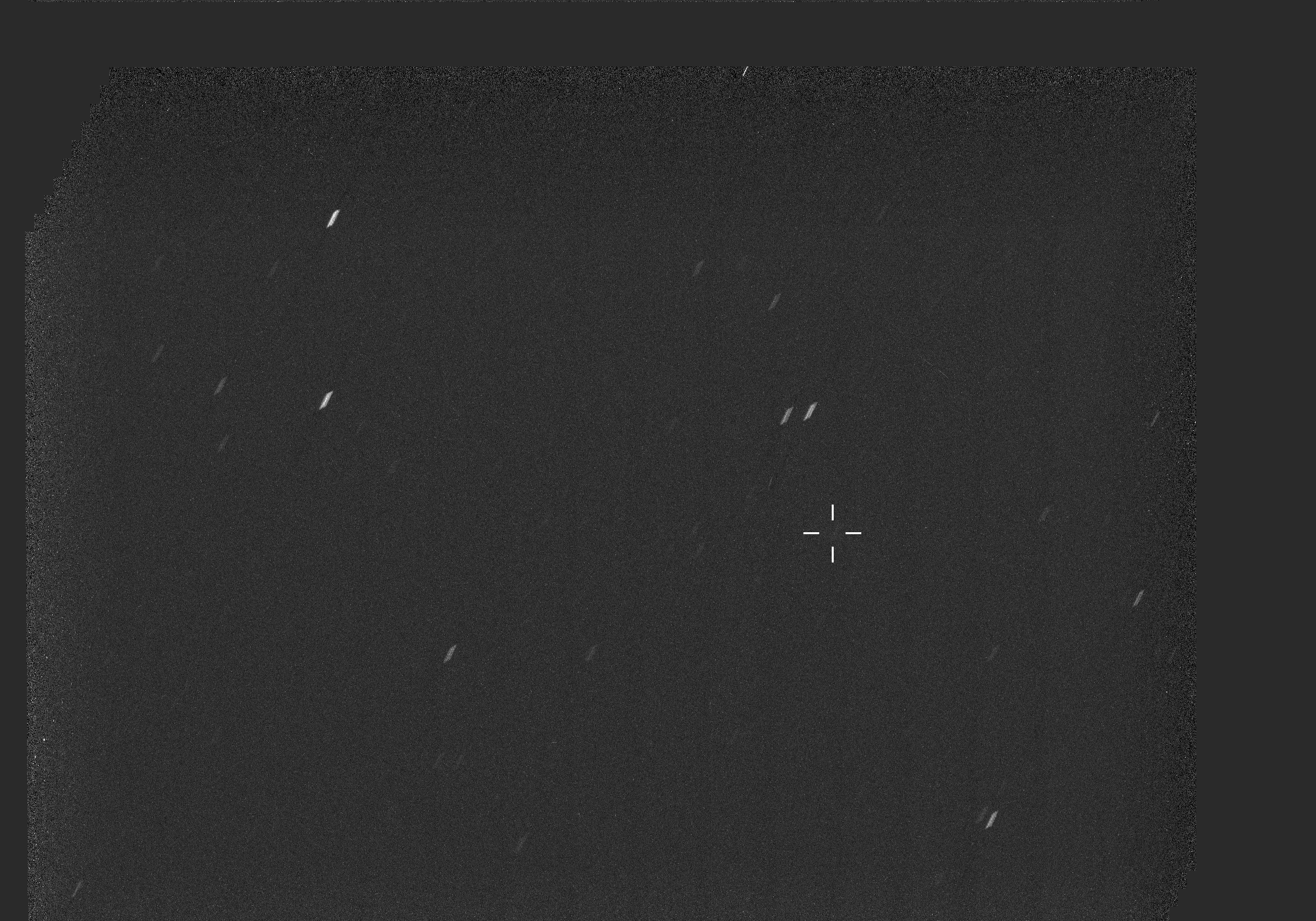 A predominantly black view of space is dotted with stars, seen as short white streaks, in an animated image that consists of two observations. In the right half of the image, interstellar comet 3I/ATLAS is a barely visible white smudge that becomes slightly more distinct in the second observation.